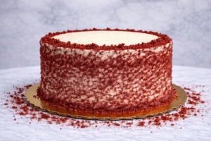 Red Velvet Cake NYC by Crumbly Cafe & Bakery featuring soft red velvet layers and rich cream cheese frosting