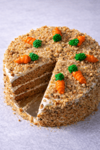 Carrot Cake NYC by Crumbly Cafe & Bakery featuring moist carrot cake layers, cream cheese frosting, and crunchy walnuts