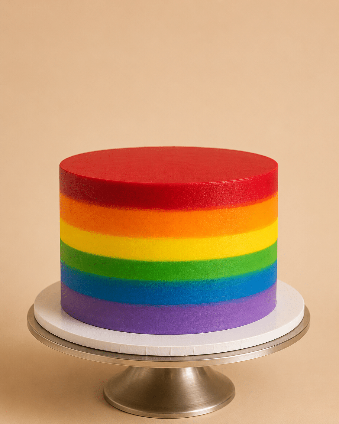 Rainbow Pride Cake with vibrant rainbow buttercream stripes and colorful Pride-inspired design by Crumbly NYC
