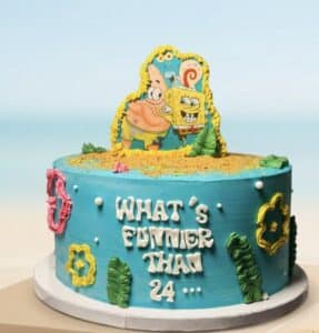 SpongeBob Birthday Cake NYC with blue buttercream, edible SpongeBob and Patrick decorations, underwater details, and personalized birthday lettering by Crumbly.